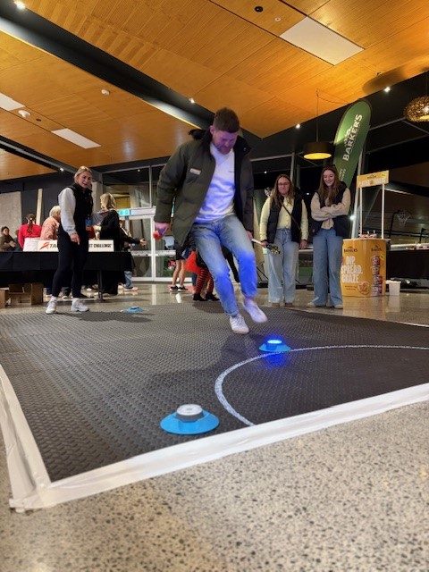 man jumping to land on floor reaction timer inside