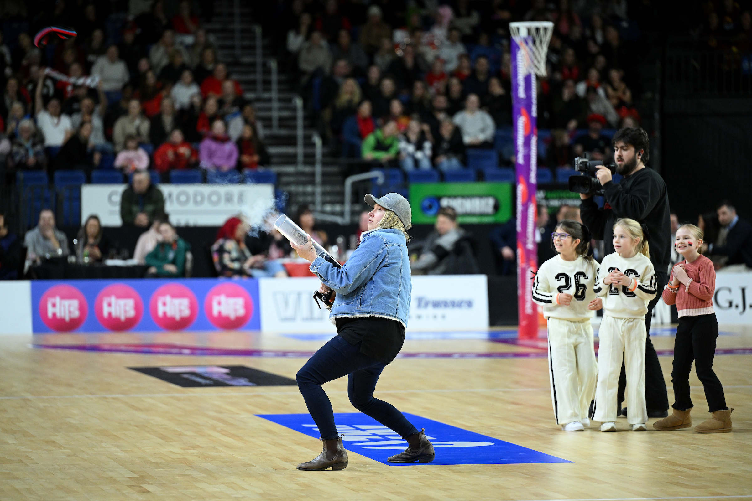 woman at sport event shooting cannon gun Wolfbrook Arena