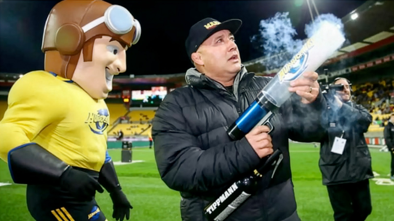 hurricanes using a t-shirt cannon gun at a game
