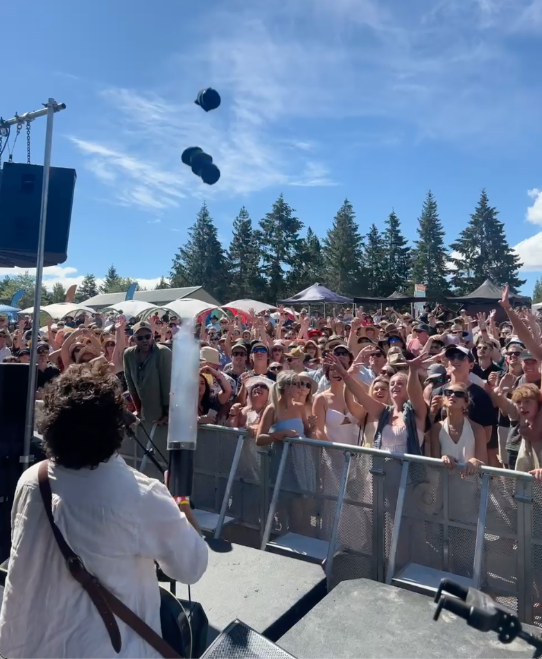 large crowd music festival. Band using tshirt cannon