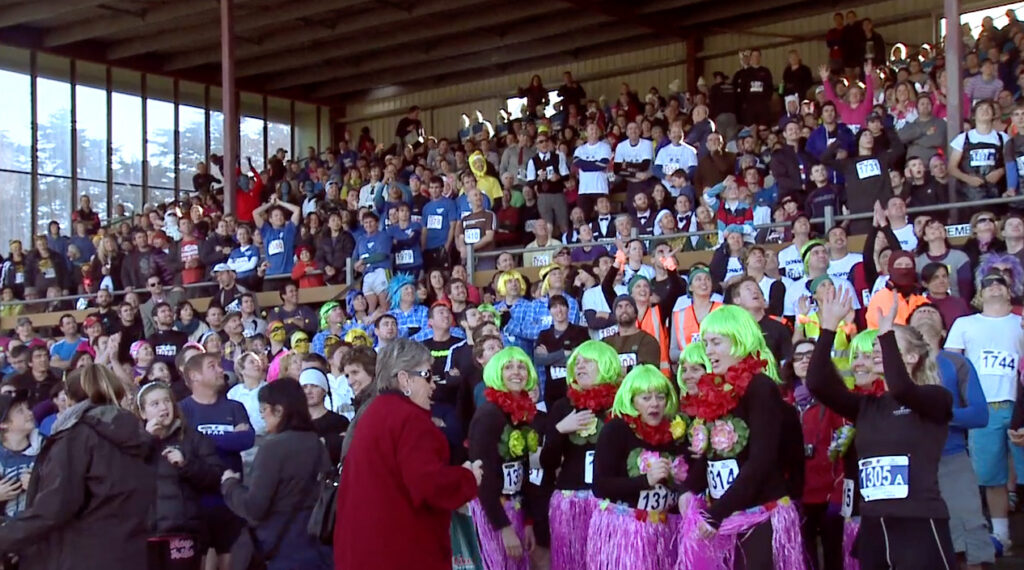 Colourful excited crowd at stadium surrounds